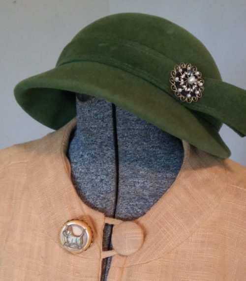 vintage pin on coat and hat